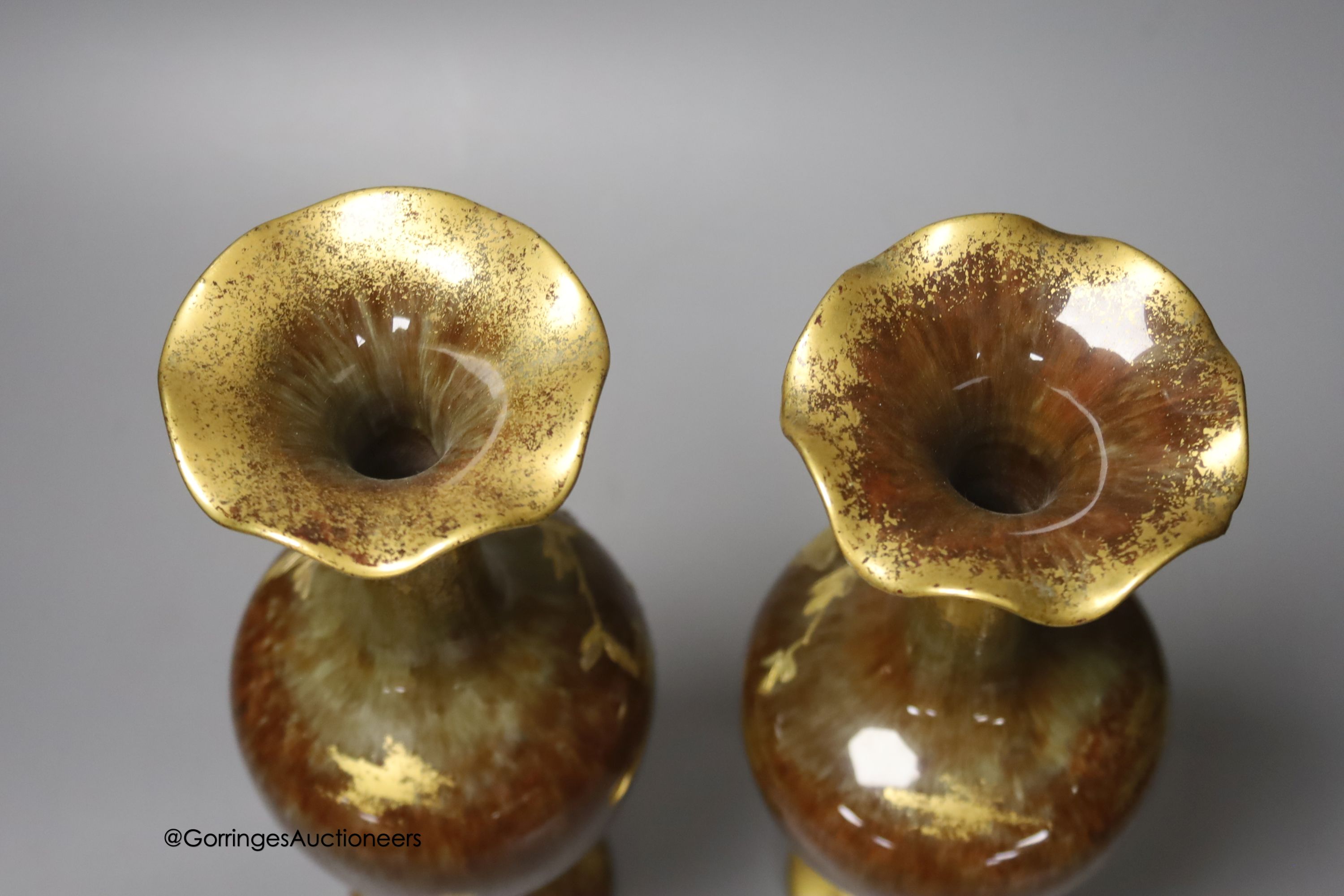A pair of Forresters Aesthetic period gilded earthenware vases, 27cm